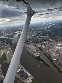 High angle view of buildings in city against sky