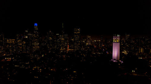 Illuminated buildings in city at night