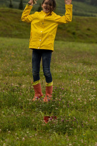 Full length of woman standing on field