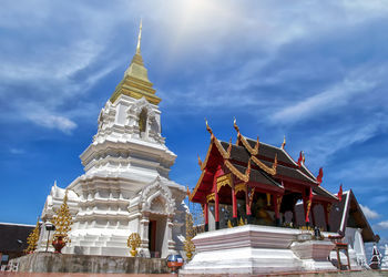 Low angle view of temple against building