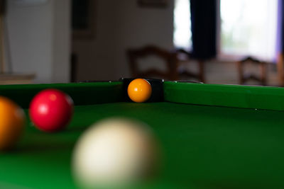 Close-up of multi colored balls on table