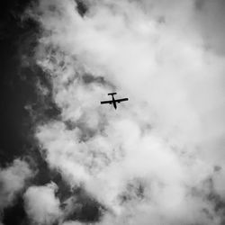 Low angle view of airplane in sky