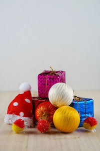 Close-up of christmas decorations against white background