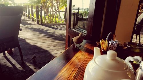Close-up of table by window