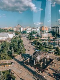 High angle view of buildings in city against sky