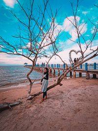 Full length of man on beach against sky