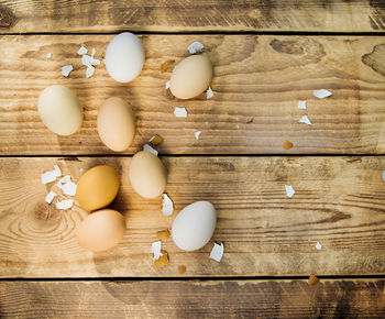 Eggs on a wooden background. sunlight and shadows. a holiday card.the concept of the easter holiday.