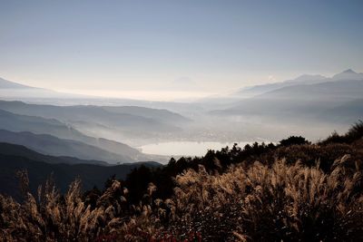 Scenic view of silhouette mountains against sky at sunset