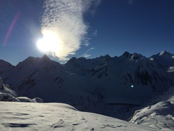 Scenic view of snowcapped mountains against sky