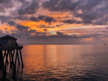 Scenic view of sea against orange sky