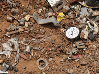 Old barometer and more wasted material and rusted