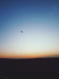 Scenic view of silhouette landscape against clear sky during sunset