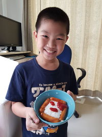 Portrait of smiling boy at home