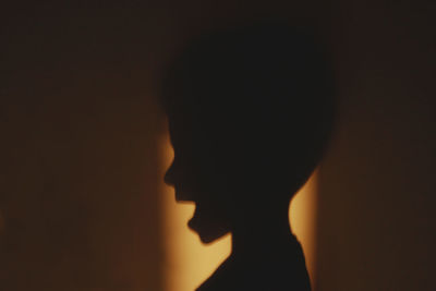 View of woman in the dark