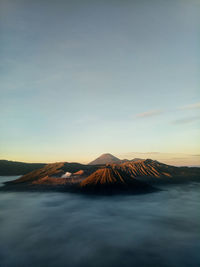 View of volcanic landscape against sky during sunset