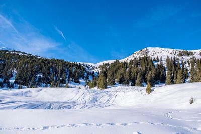 Scenic view of snowcapped mountains against sky