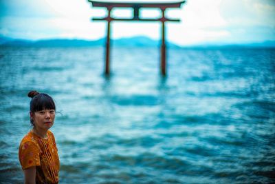 Portrait of boy standing in sea