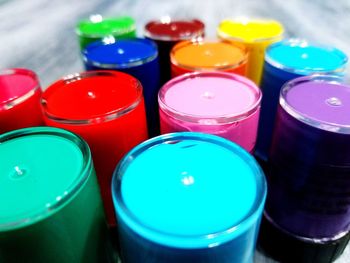 Close-up of colorful paint in containers