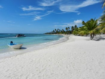 Scenic view of beach against sky isla saona