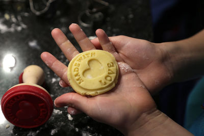 Close-up of hands making cookies