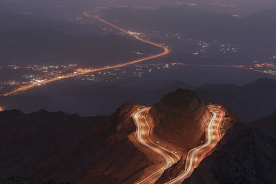 High angle view of illuminated road at night
