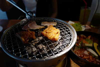 Close-up of meat on barbecue grill