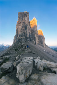 Rock formations on landscape against sky