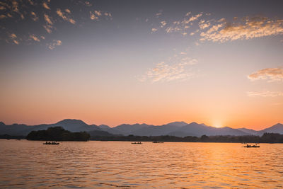 Scenic view of lake against sky during sunset