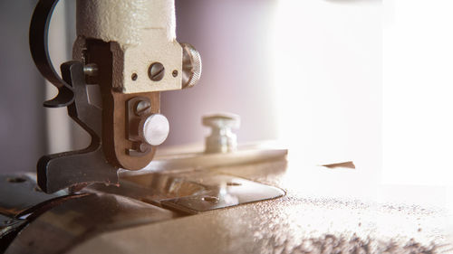 An old leather skiving machine for leather craft against sunlight 