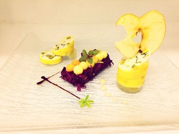 Close-up of lemons on wooden table