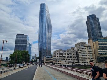 Skyscrapers in city against sky