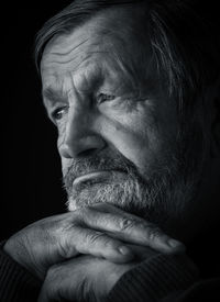 Elderly pensive man black and white portrait