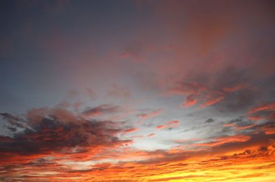 Low angle view of cloudy sky at sunset