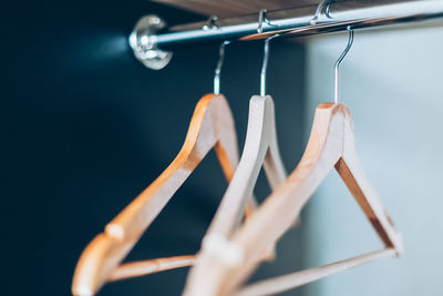 Close-up of clothespins hanging on rope