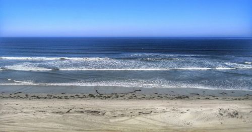 Scenic view of sea against clear sky