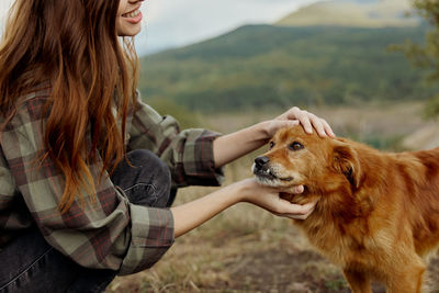Midsection of woman with dog