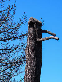 Low angle view of built structure against clear blue sky