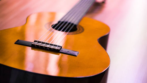 Close-up of guitar on table