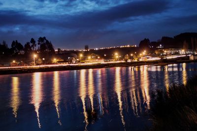 Reflection of illuminated buildings in water at night