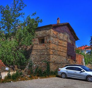 View of old building against clear blue sky