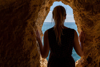 Rear view of woman looking at sea