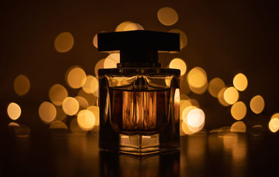 Close-up of tea light candles on table