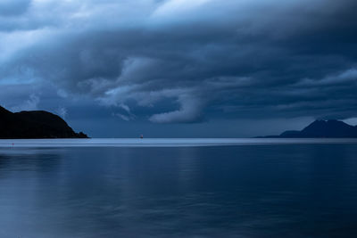 Scenic view of sea against sky at dusk