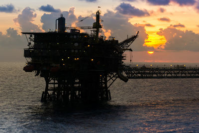 Silhouette of an offshore platform during sunset at offshore terengganu oil field