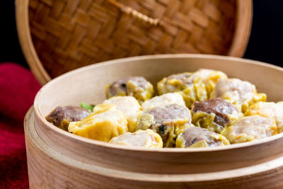 Close-up of chinese dumplings in bamboo basket