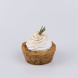 Close-up of cupcakes against white background