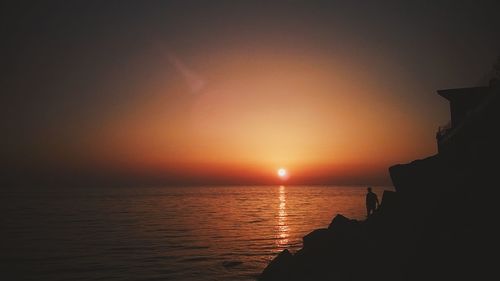 Scenic view of sea at sunset