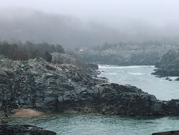 Scenic view of sea against sky during foggy weather