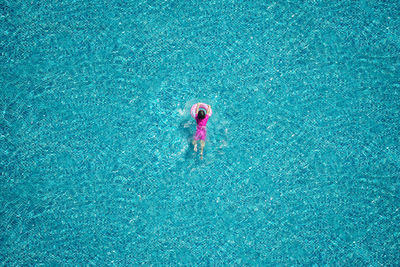 High angle view of child in swimming pool