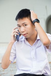 Young man using mobile phone